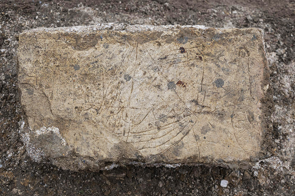 Graffiti from the excavated ramparts at Caen showing a sailboat © Inrap/Emmanuelle Collado