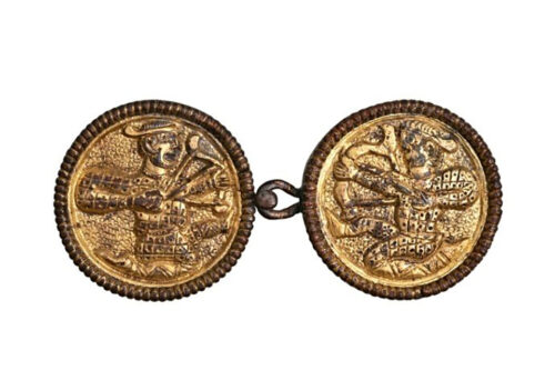 Clasps fro woman's cape showing archers g Landesmuseum of NÖ/Benedict Seidl. Press Photo