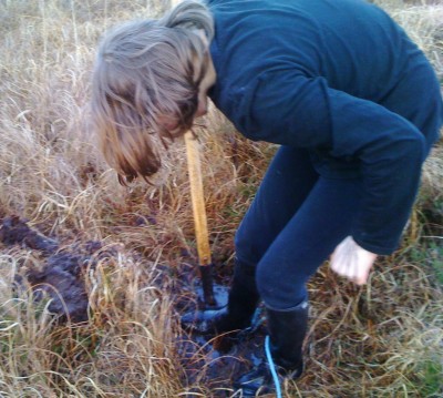 Burrying the butter in the bog at Mayberry © Brian Kaller
