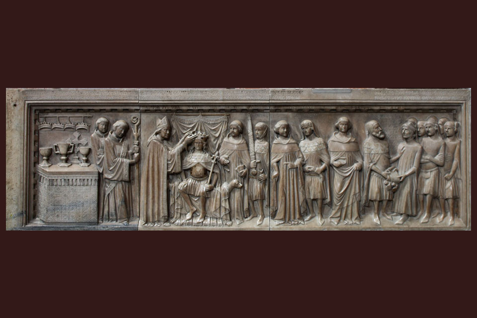 Relief showing the Coronation of Charles in Milan 1354. Notice the crowns hanging above the altar and the bearer of the sword. Workshop of Matteo da Campione. . © Museo e Tesoro del Duomo di Monza