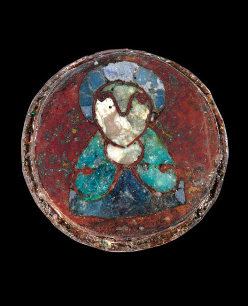 Disc brooch featuring saint from ca. 800- 900. Hamburg Archaeological Museum. Wikipedia
