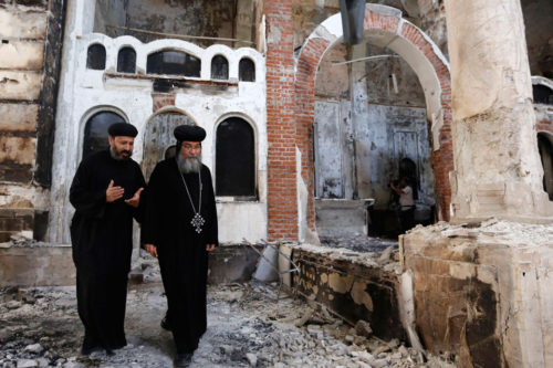 Coptic Priests in front of church in Cairo. Source: Pinterest