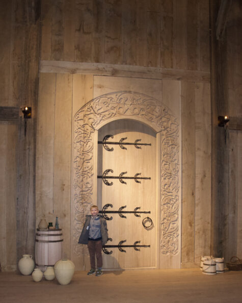 Asger posing before the door with the entrance into Heorot' hall in Lejre. © Schousboe